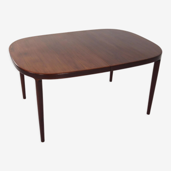 Oval table, covered with rosewood veneer.Design of the 70s