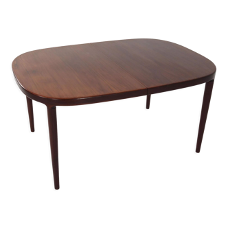 Oval table, covered with rosewood veneer.Design of the 70s