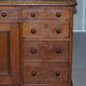 Antique Victorian oak kneehole desk with 18 double-sided drawers.