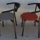 4 gondola-style chairs with a sturdy metal frame and faux leather.