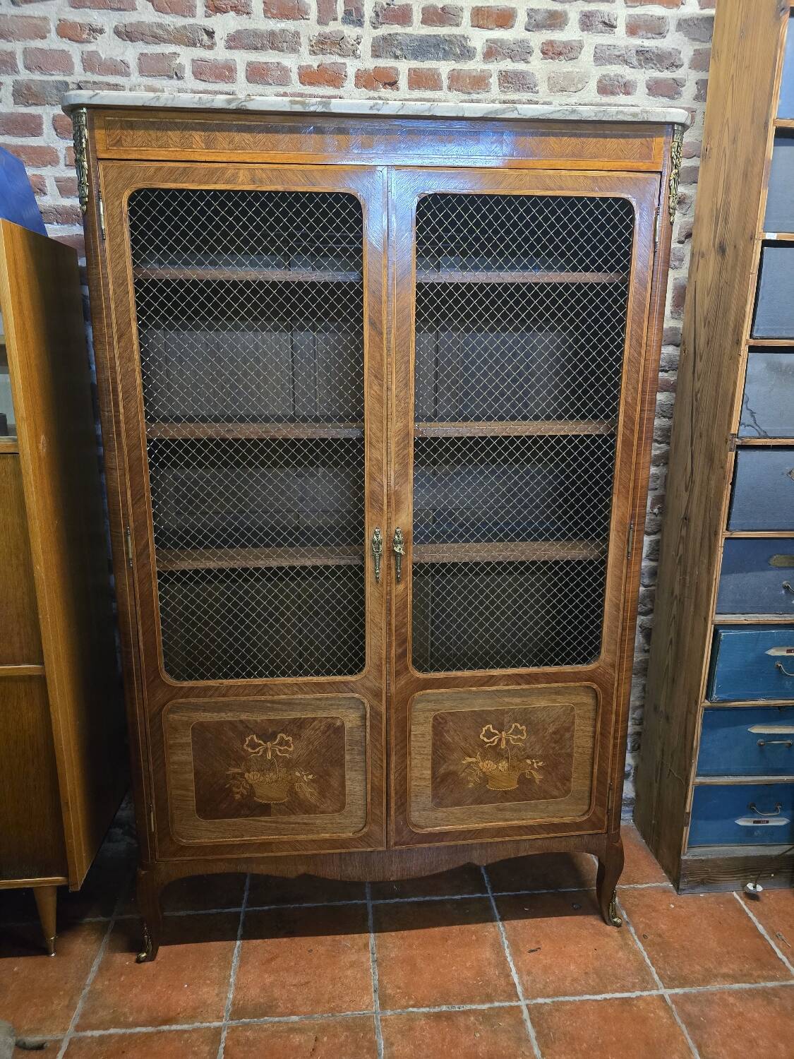 Marquetry bookcase with marble top