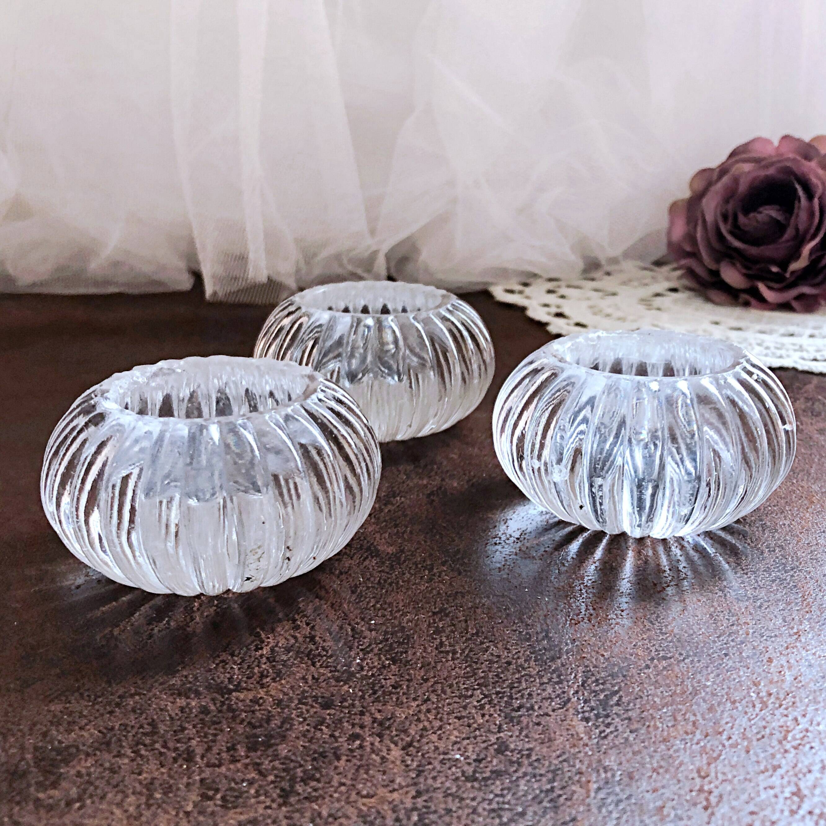 Trio of salt shakers, pepper shakers, molded glass salt shakers