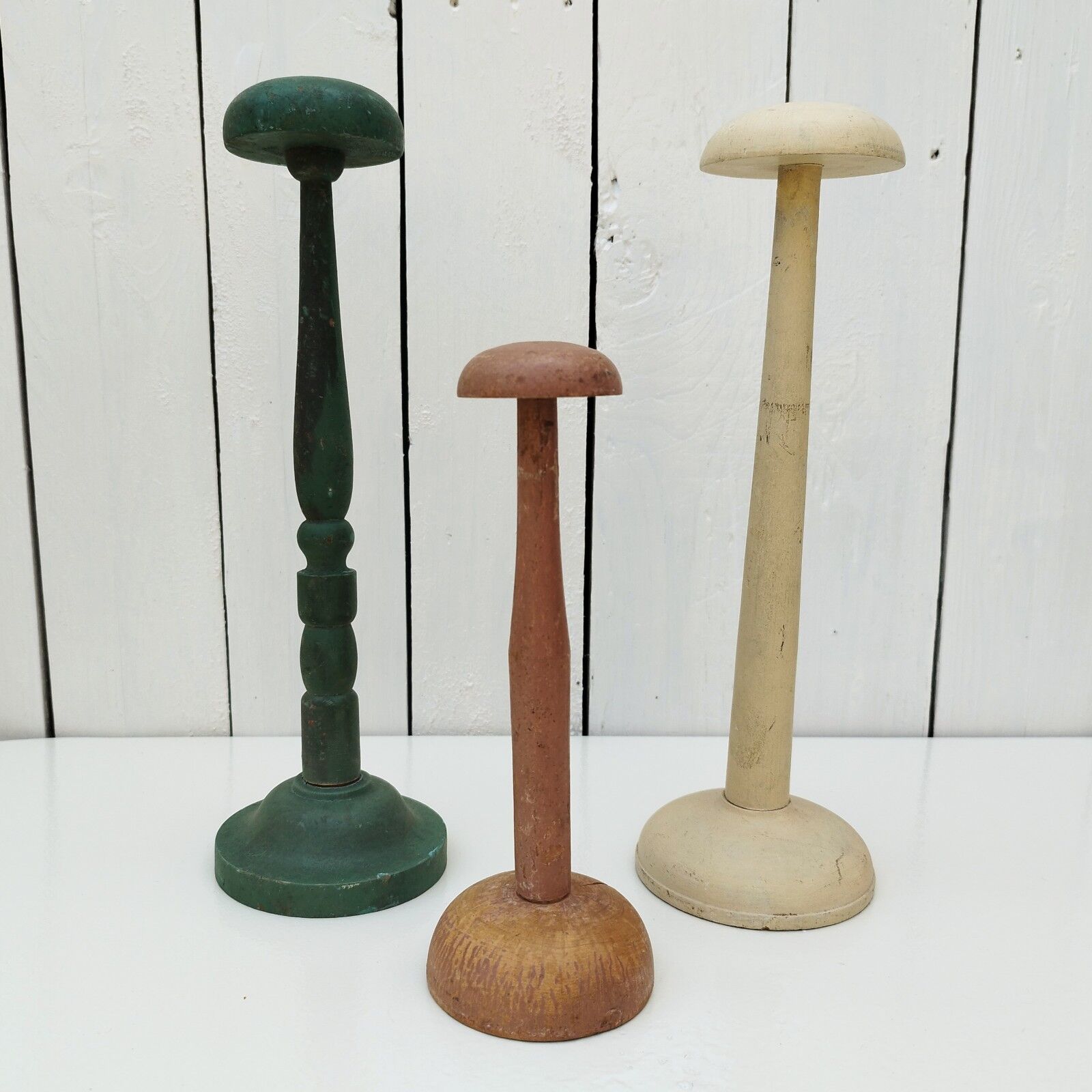 Three vintage wooden hat holders milliner