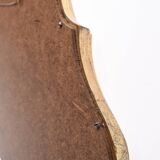 Miroir en bois doré style baroque.