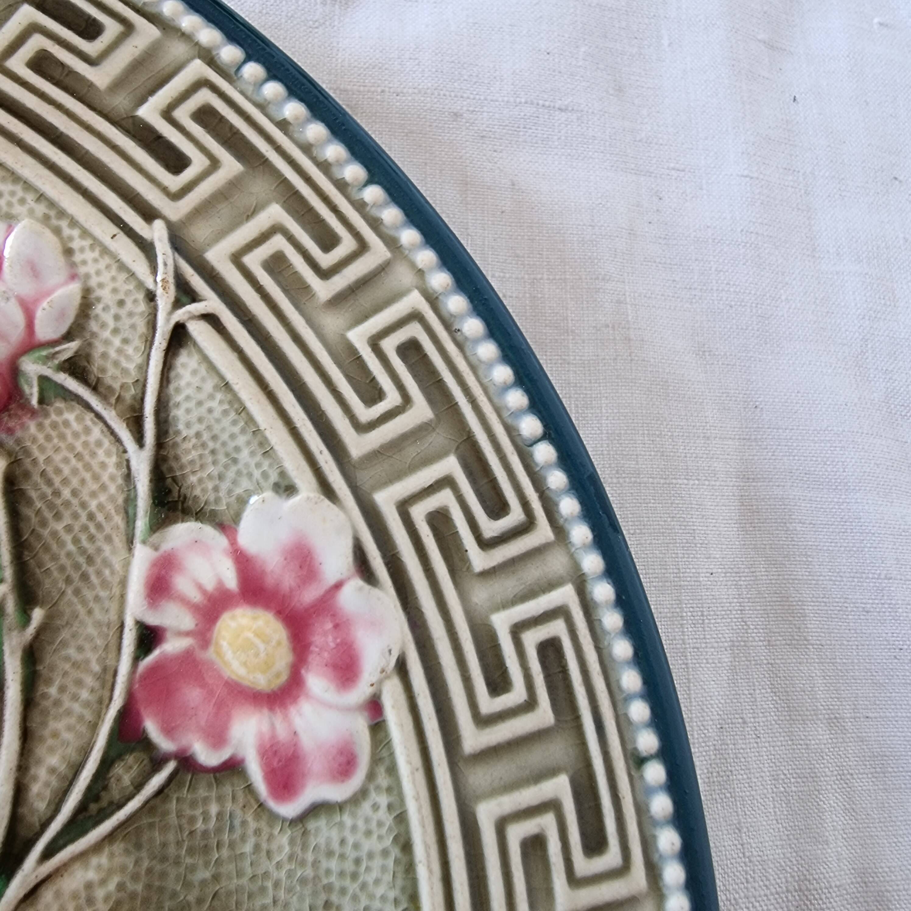 Choisy Le Roi majolica or barbotine dish decorated with leaves and pink flowers from the 19th century