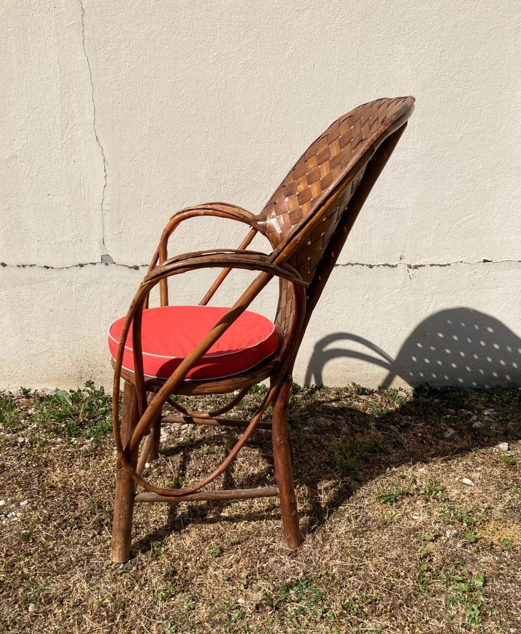 Vintage 1970s armchair in curved woven chestnut + seat cushion
