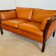 Canapé vintage danois des années 60 en cuir cognac pour 2 personnes.