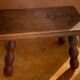 Footstool in varnished wood turns old
