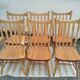 Set of 6 western bistro chairs, including 2 with armrests.
