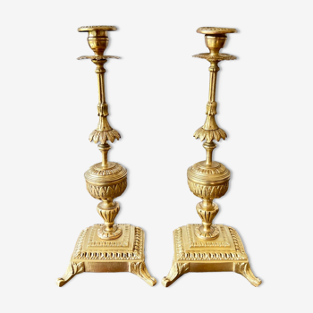 Duo of antique bronze candle holders