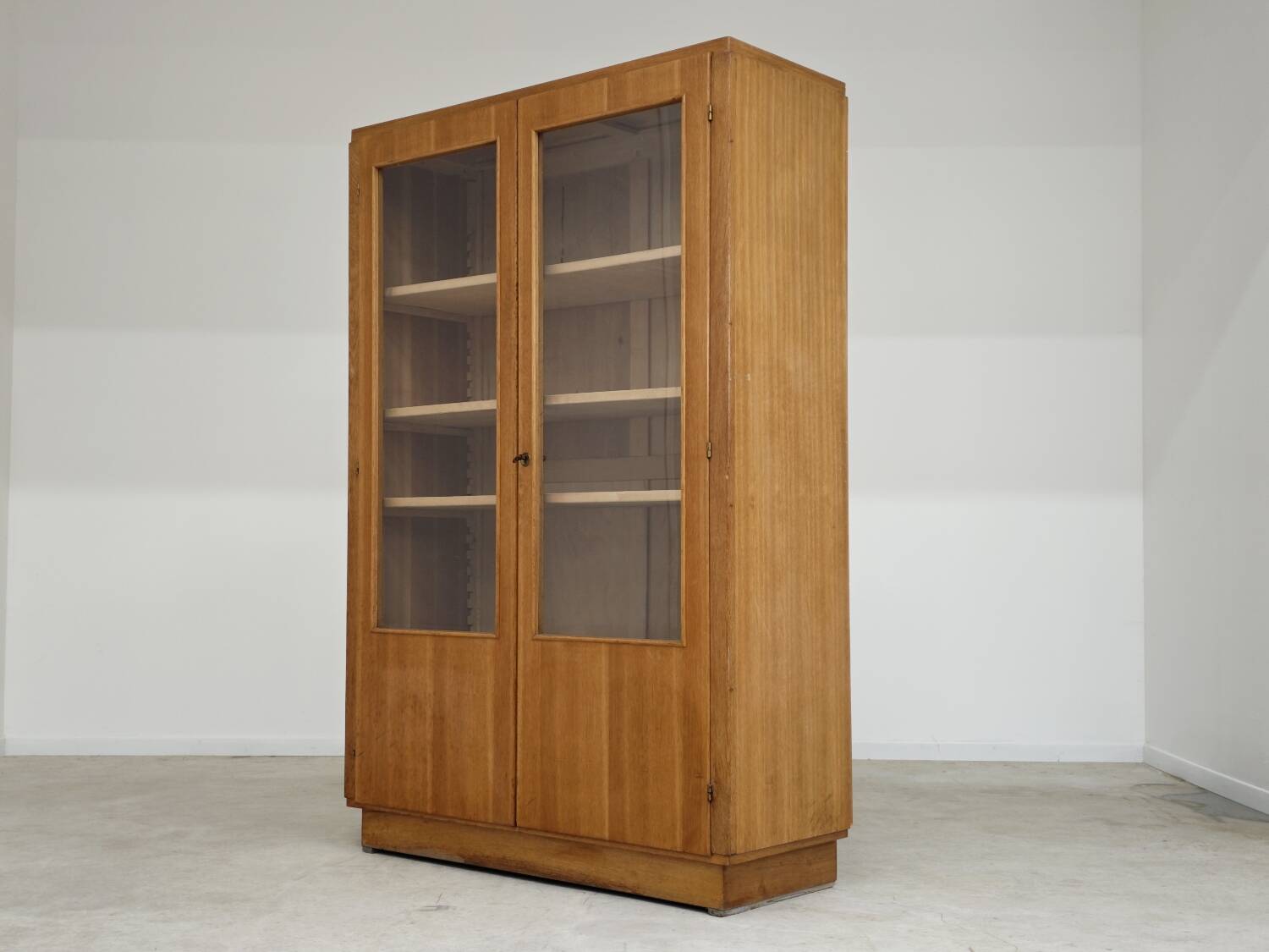 Oak glass-fronted school cabinet 1960