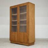 Oak glass-fronted school cabinet 1960
