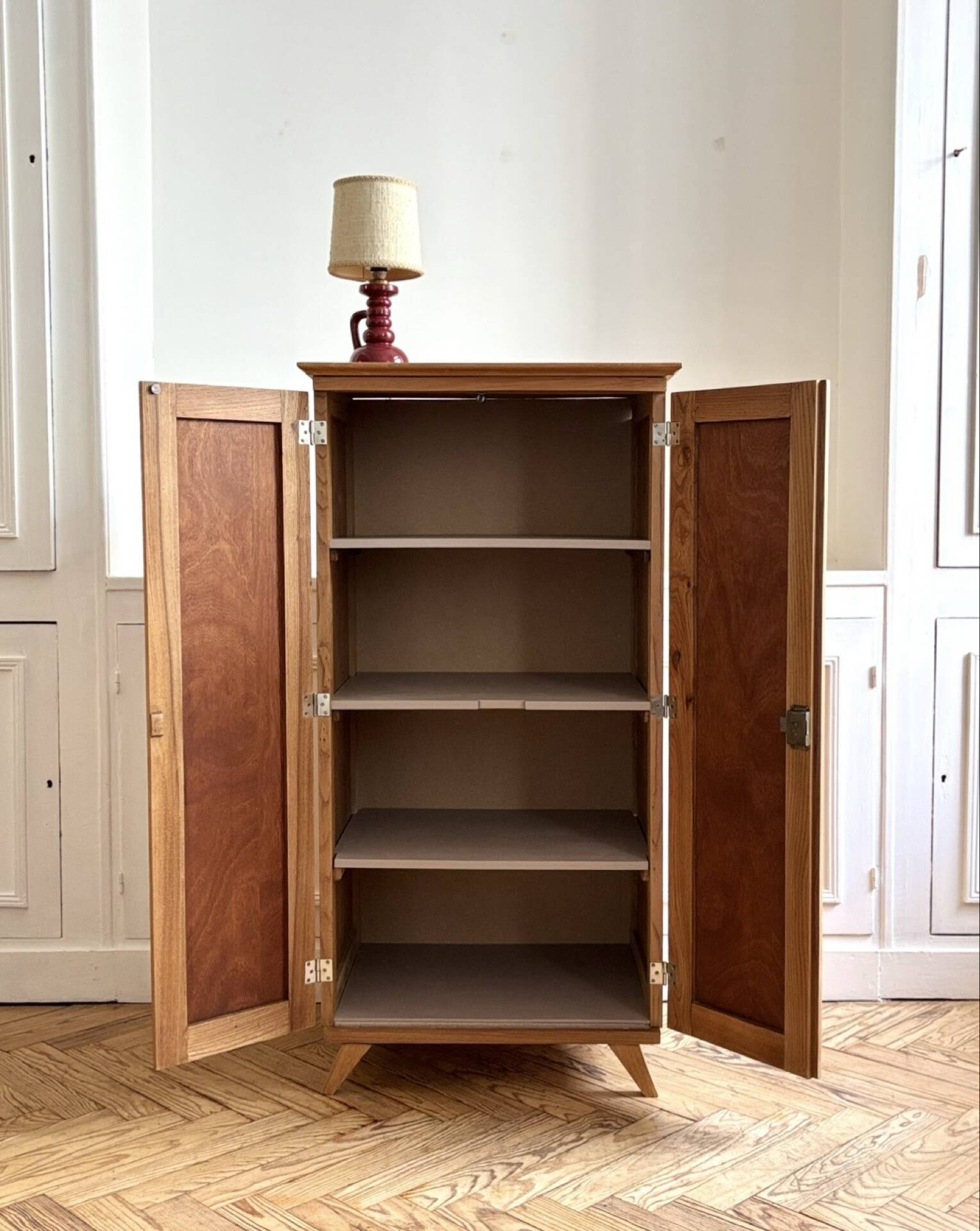 Small oak cabinet with tapered legs.