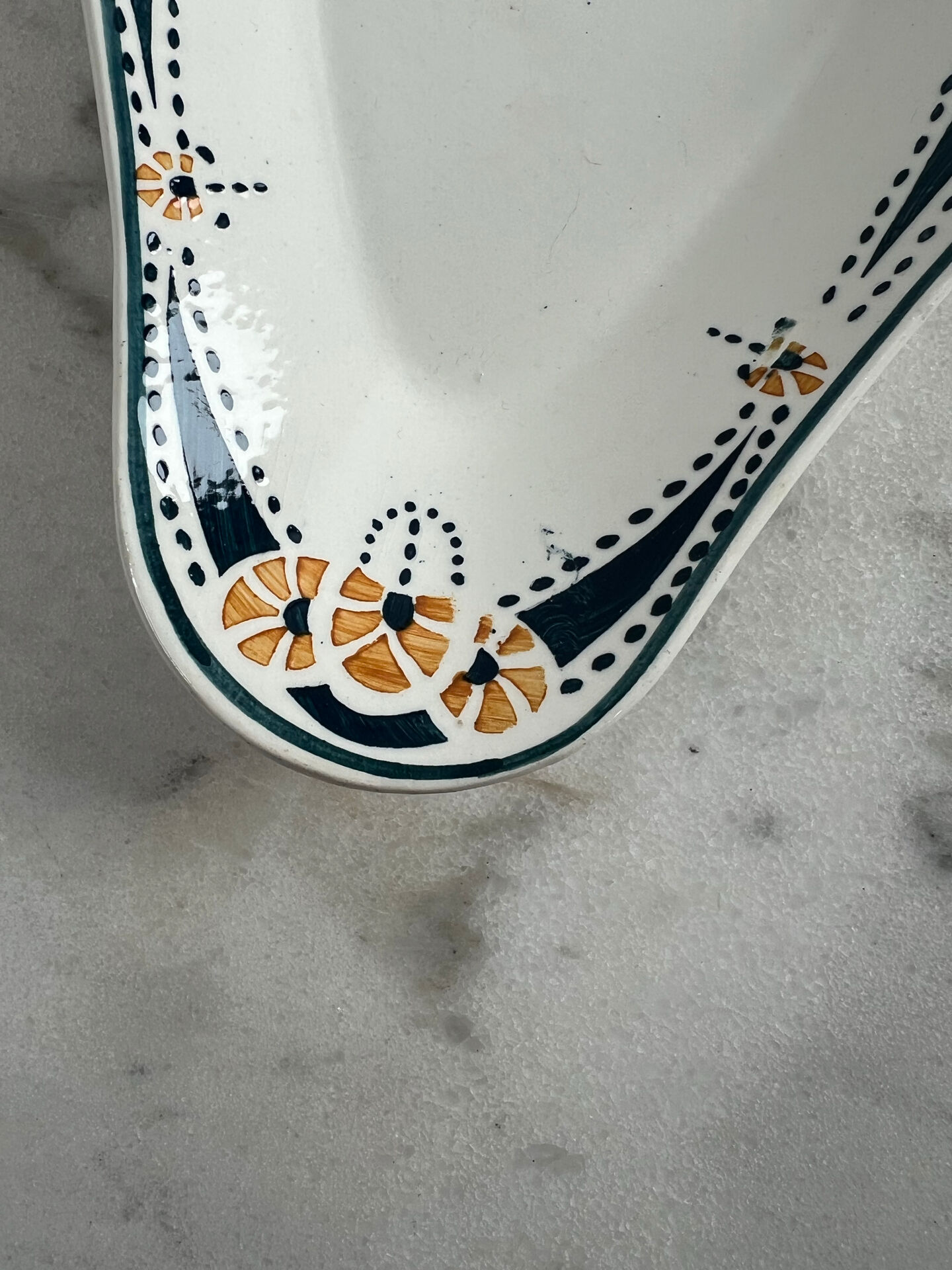 Longwy ramekin with blue and orange floral decoration.