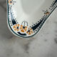 Longwy ramekin with blue and orange floral decoration.
