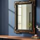 Antique wall mirror in blackened wood and gilded stucco, 19th-century Dutch style.
