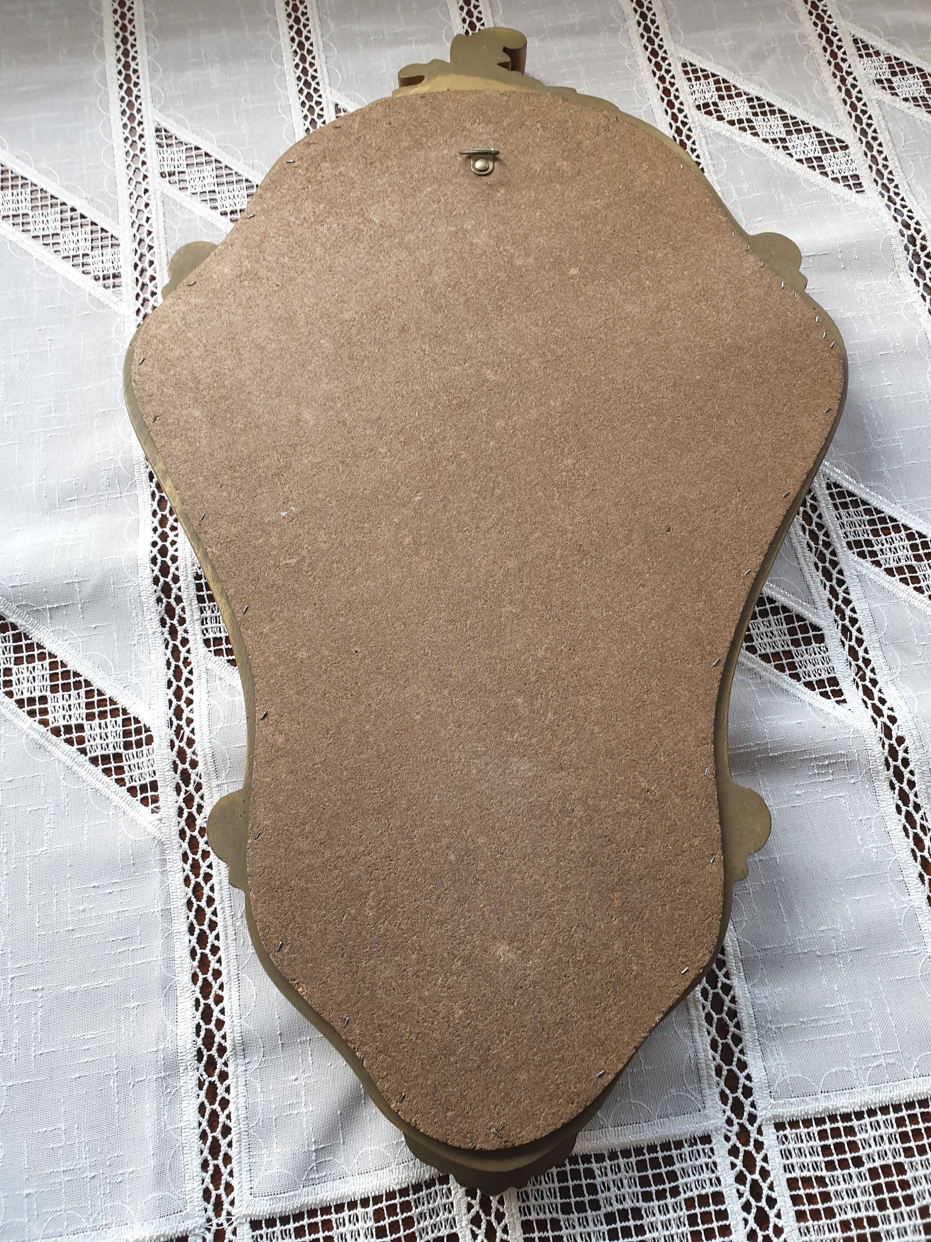 Rocaille mirror in gilded carved wood