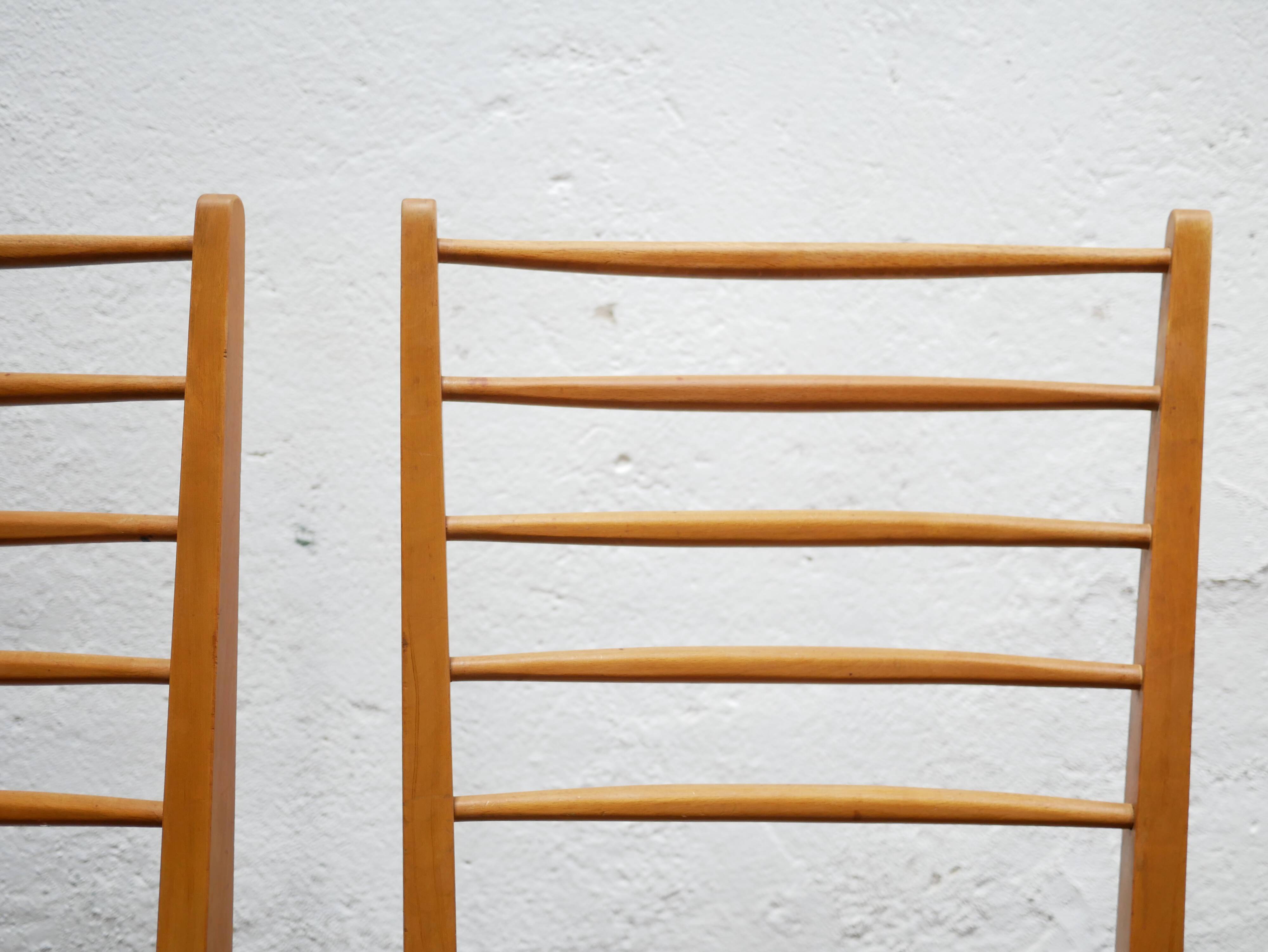 Series of 4 vintage chairs in wood and skaï