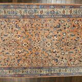 Large wool and silk oriental carpet.