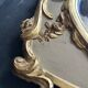 Napoleon III mirror in carved gilded wood, oval mercury glass.