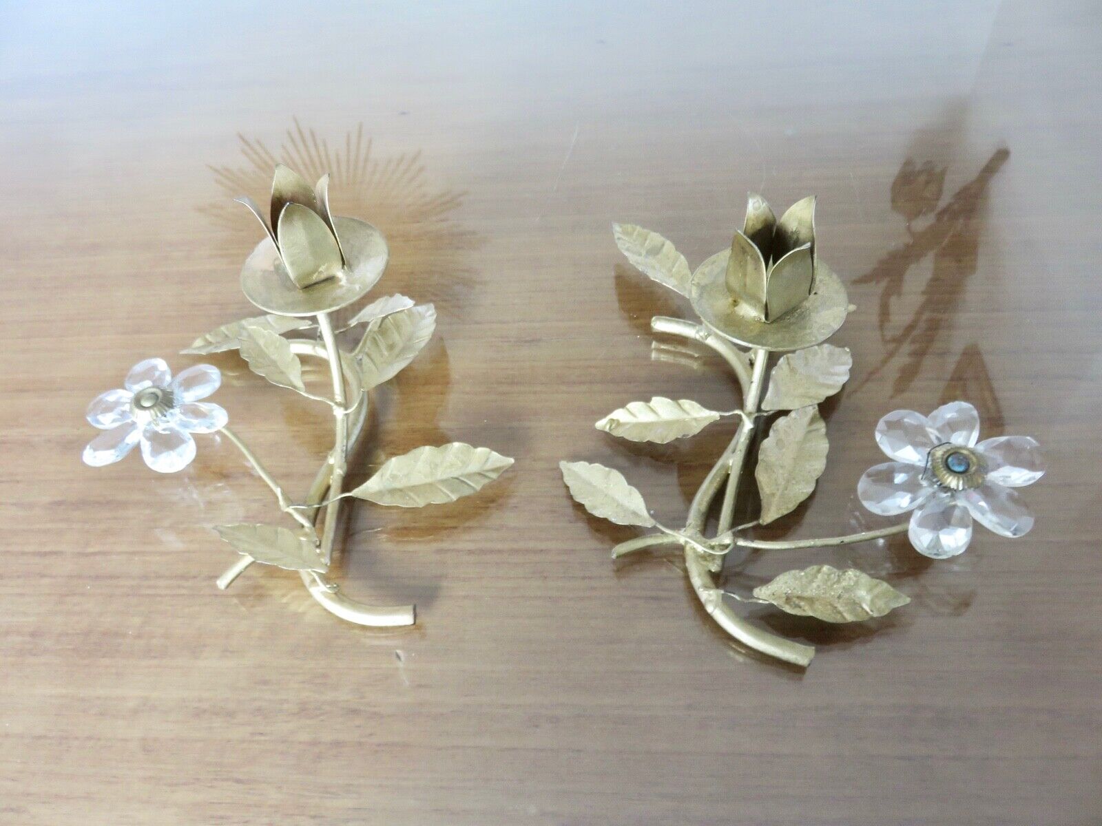 Pair of gilded metal candle holders and tassels