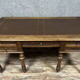 Renaissance style center desk with side pulls in carved walnut