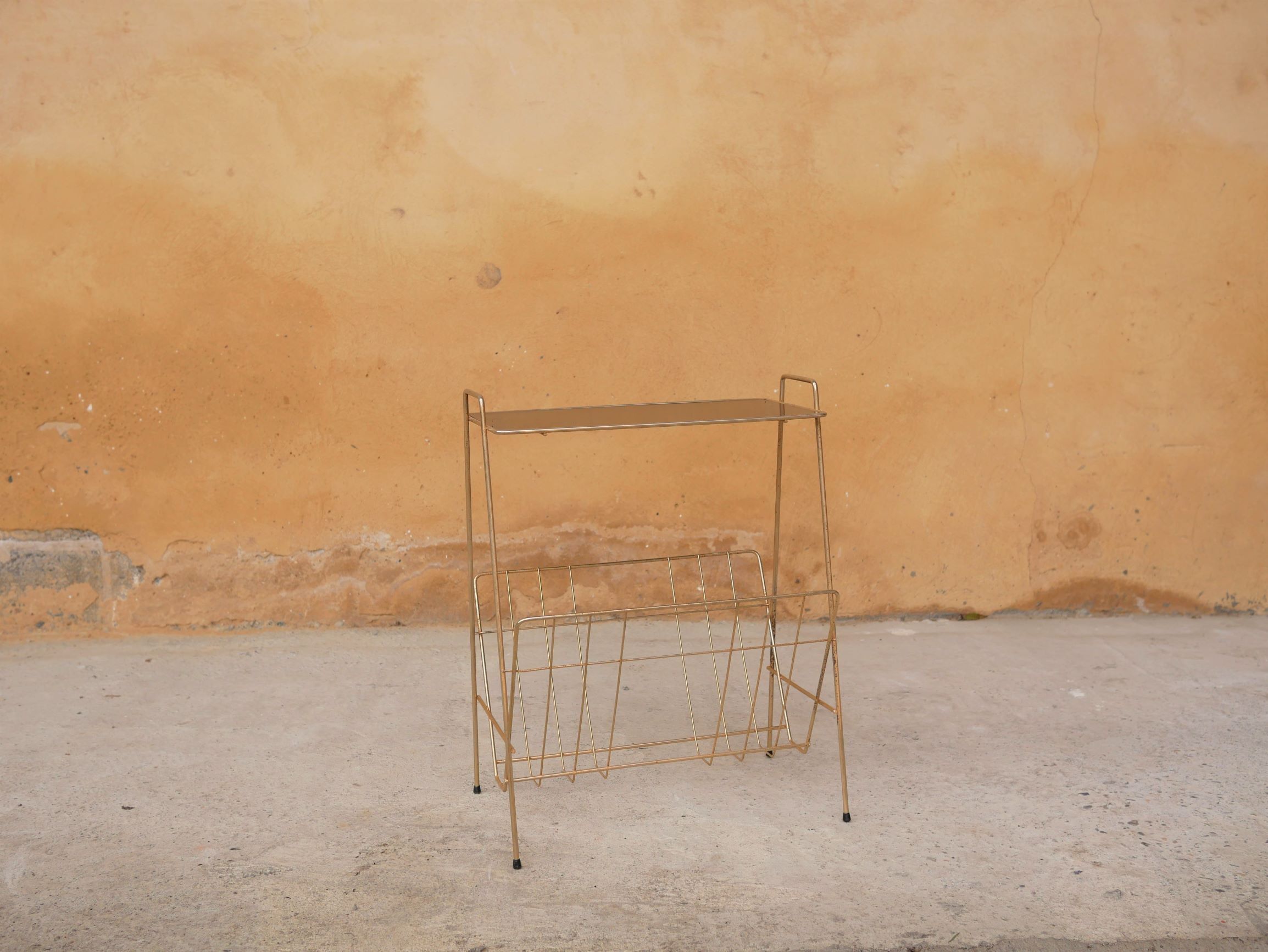 Vintage gold metal magazine rack
