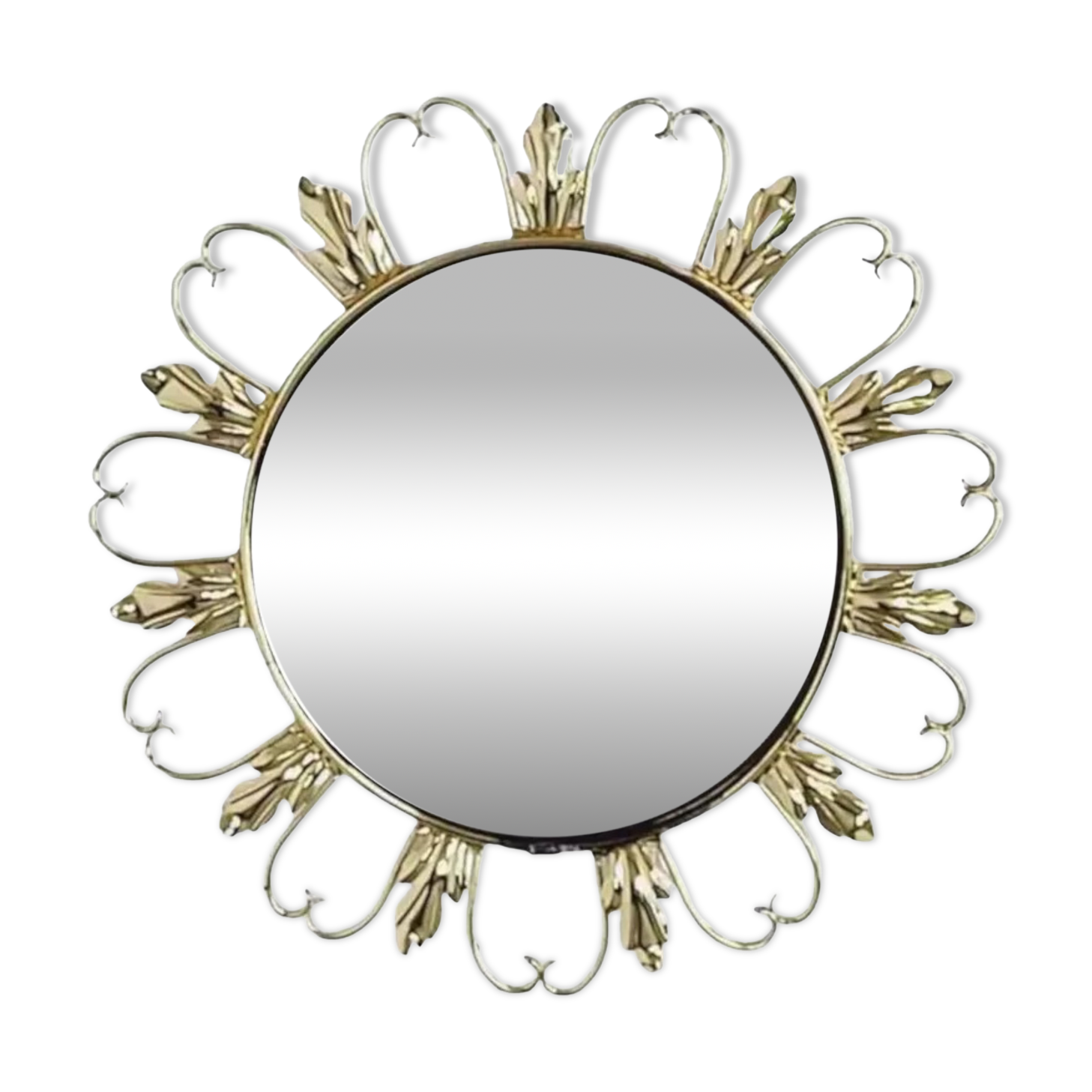 Round mirror on brass frame with scrolls