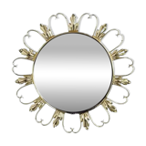 Round mirror on brass frame with scrolls