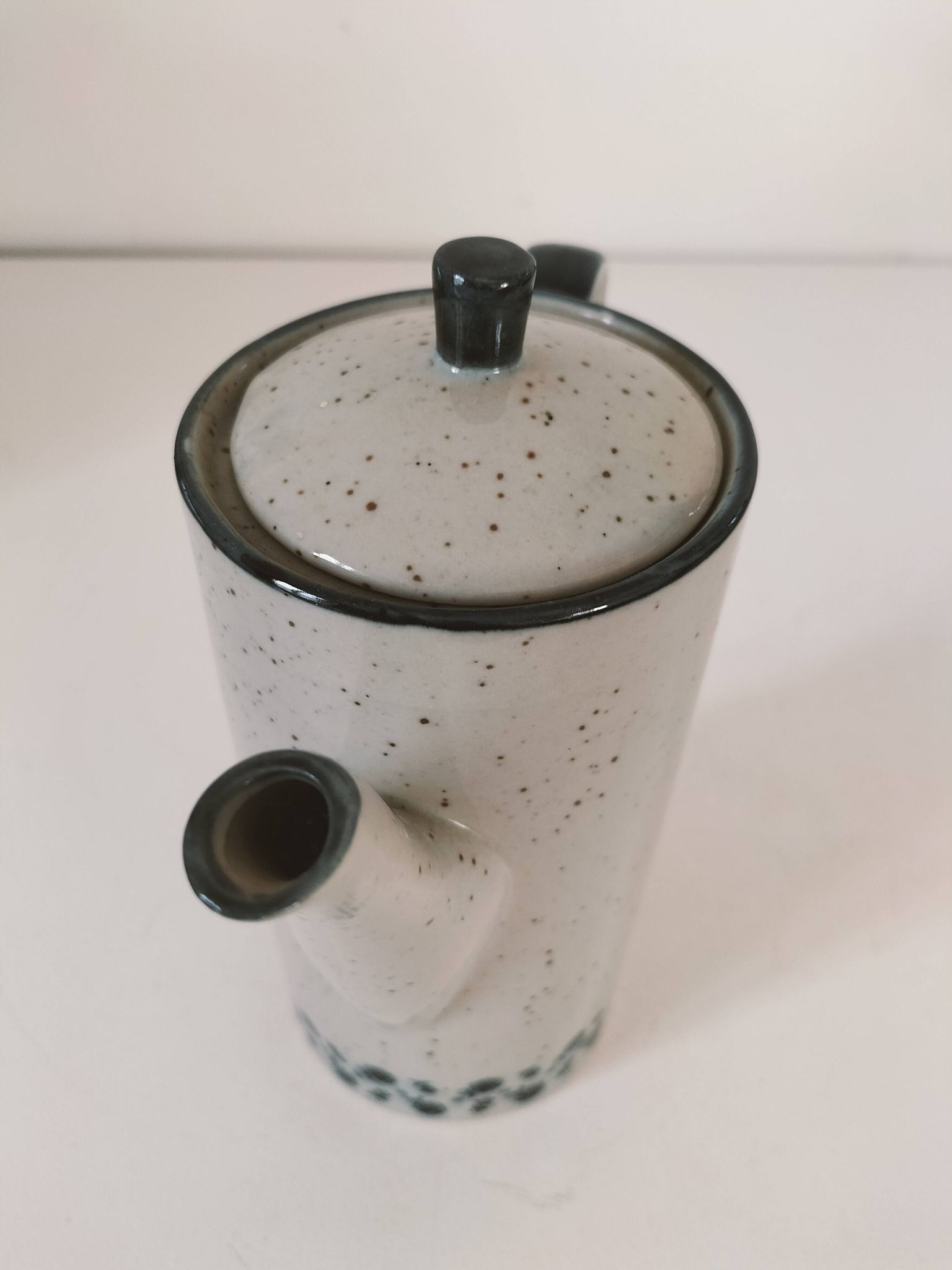 Vintage speckled stoneware coffee pot – navy blue floral decoration