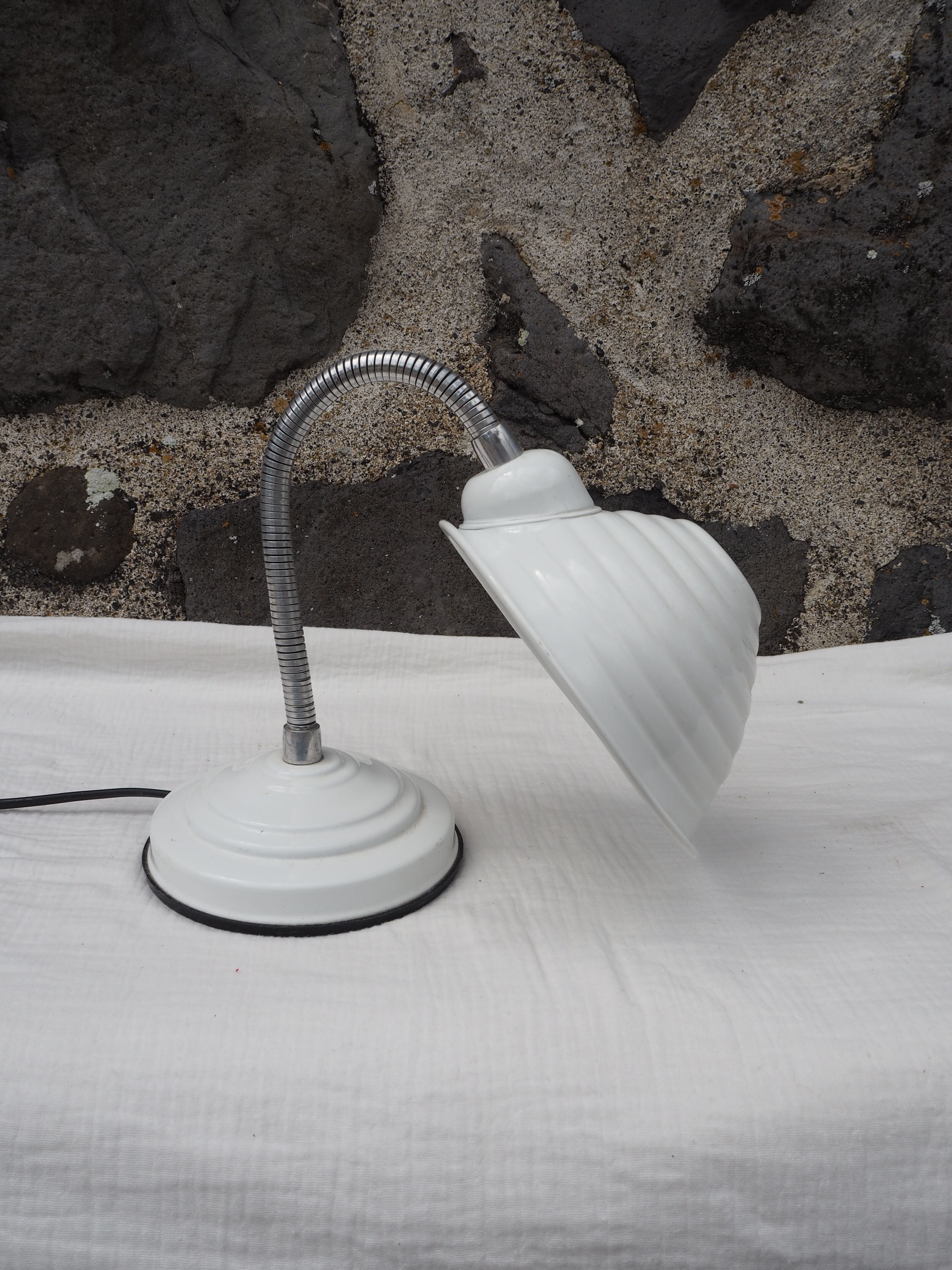 White articulated lamp with metal arm