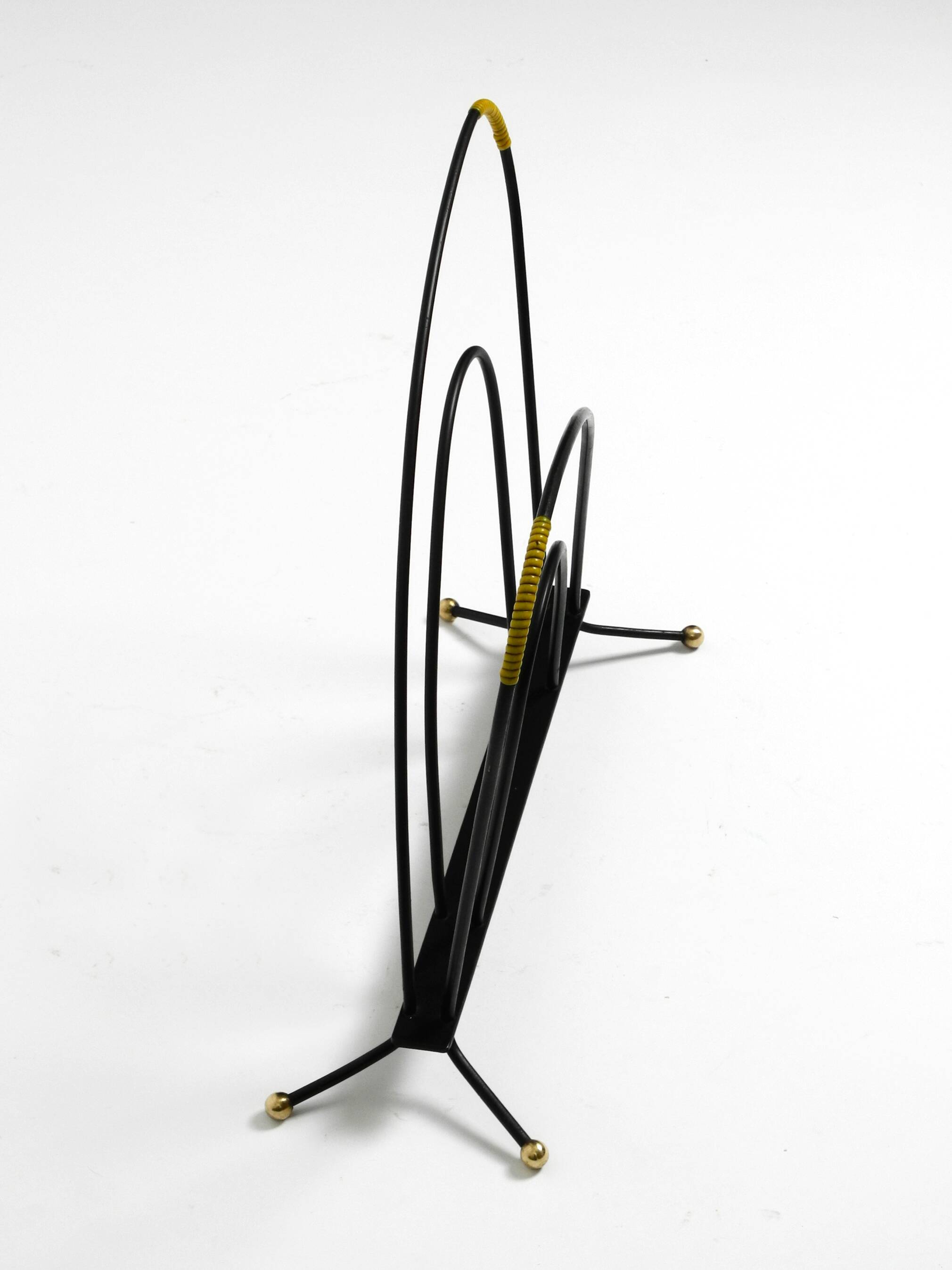 Mid Century newspaper and magazine stand made of iron with brass details