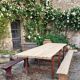Antique French folding garden table set with benches, pine and chestnut, circa 1900–1920.