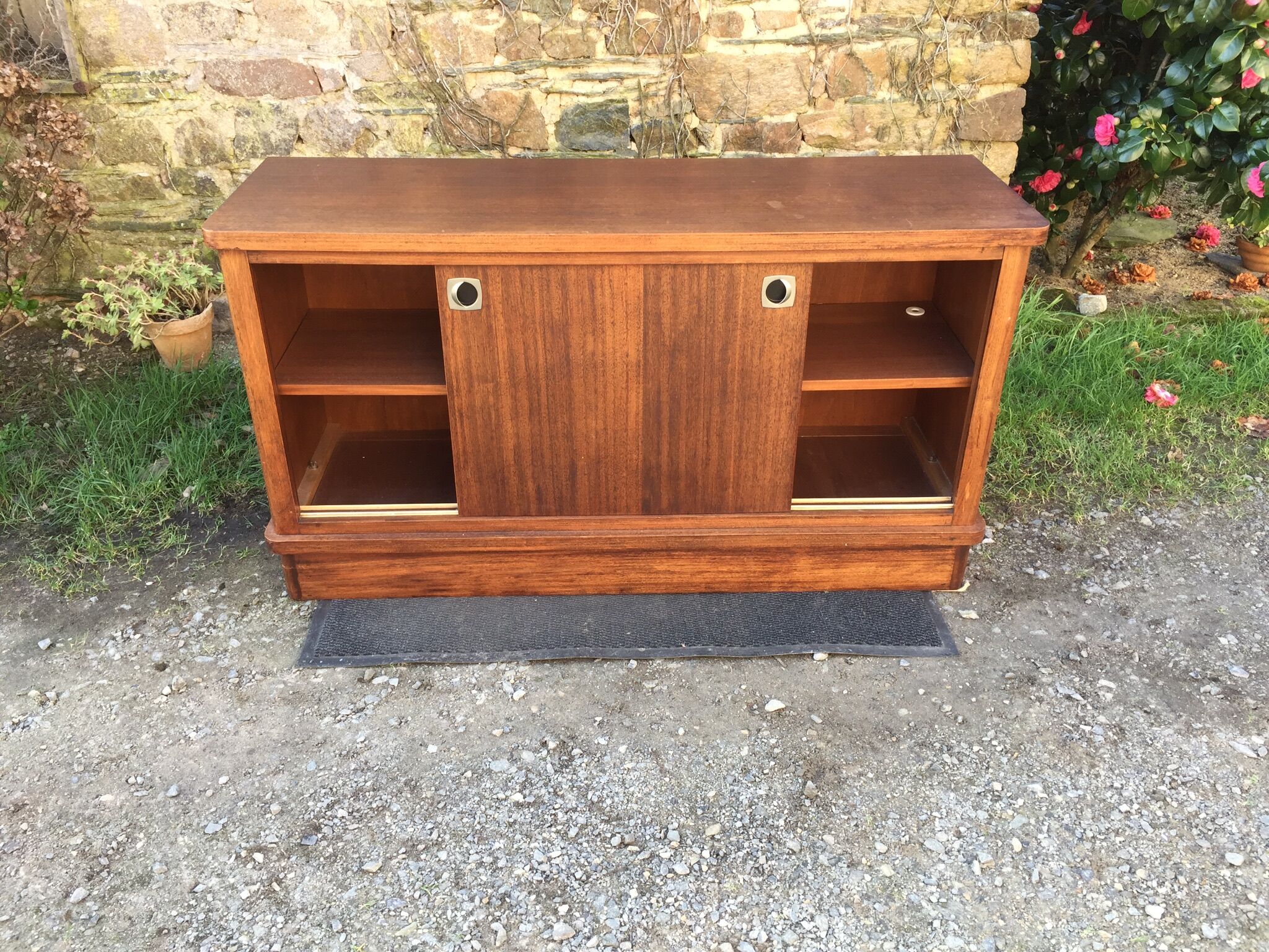 Low sideboard with sliding doors in waxed mahogany
