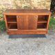 Low sideboard with sliding doors in waxed mahogany