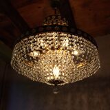 Antique castle style chandelier with tassels and floral details