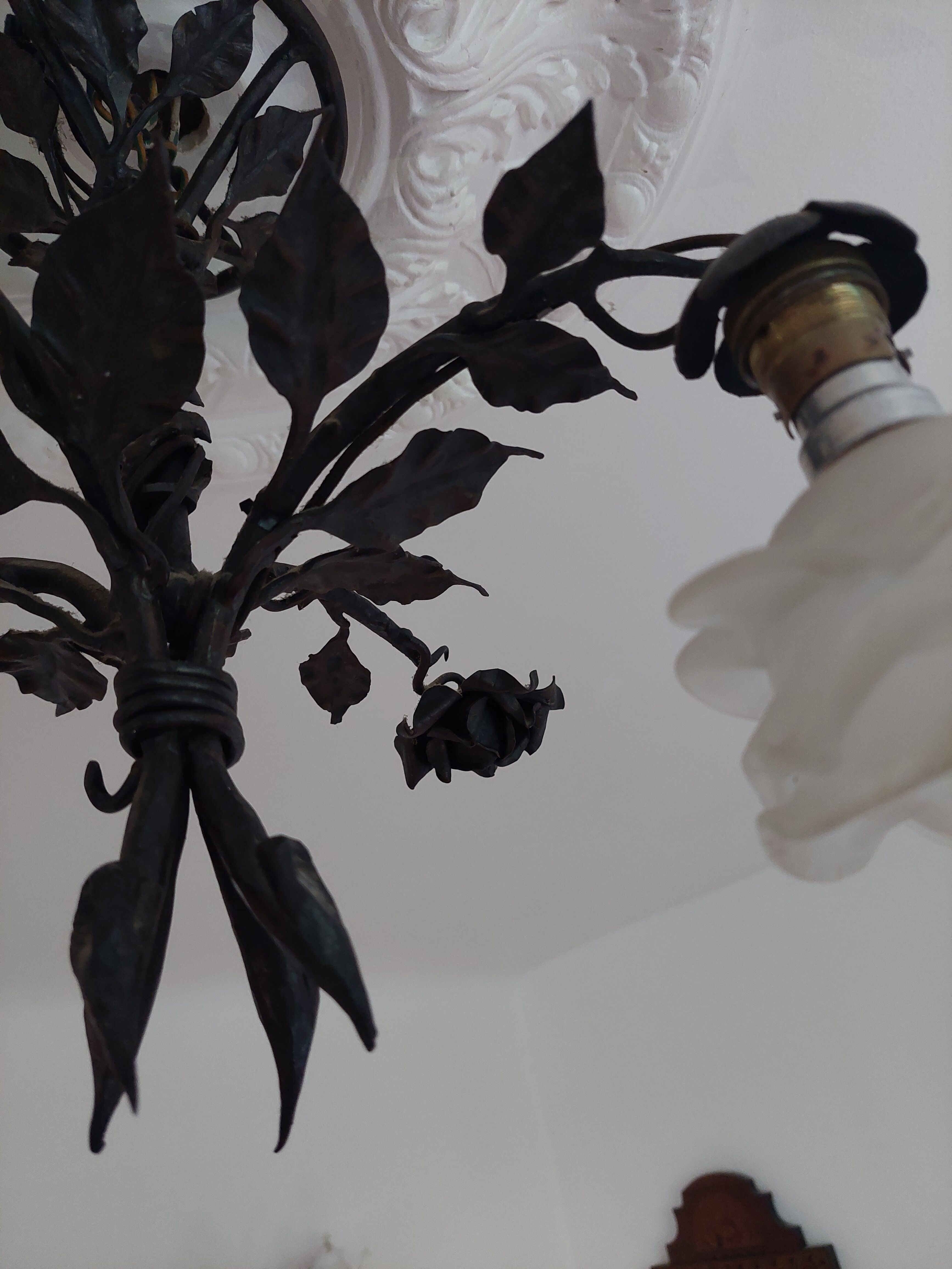 Chandelier with wrought iron and glass rose patterns