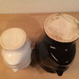 2 black and white ceramic head vases, face