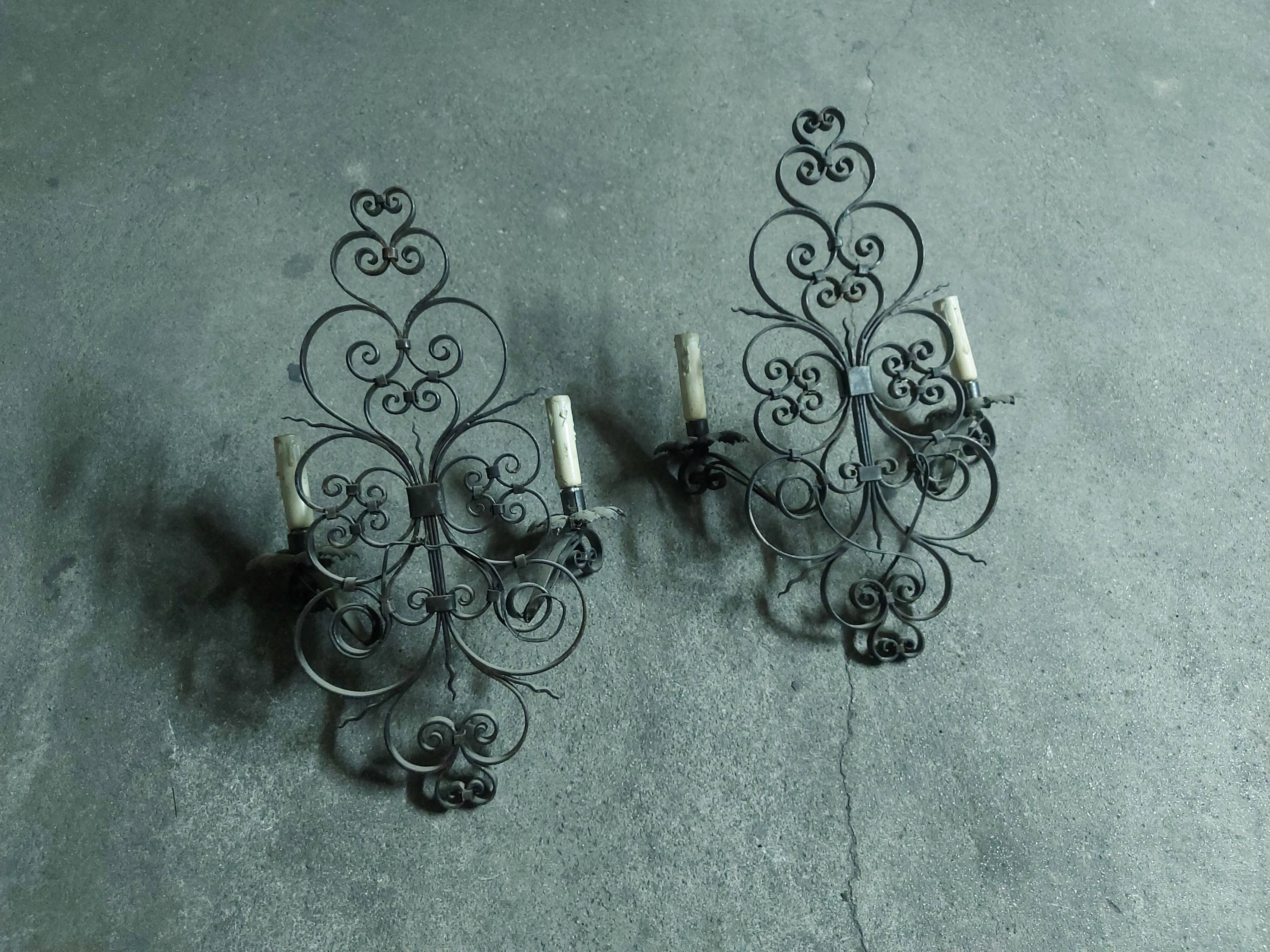 Two large wrought iron wall lights