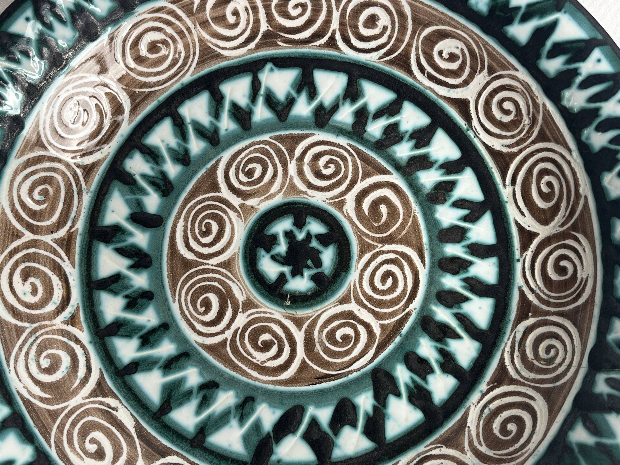 Picault, polychrome earthenware plate with geometric decoration from the 20th century.