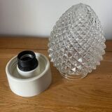 Diamond tip glass wall lamp in the shape of a bread apple.