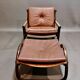 Fauteuil et son ottoman rotin et cuir 1950