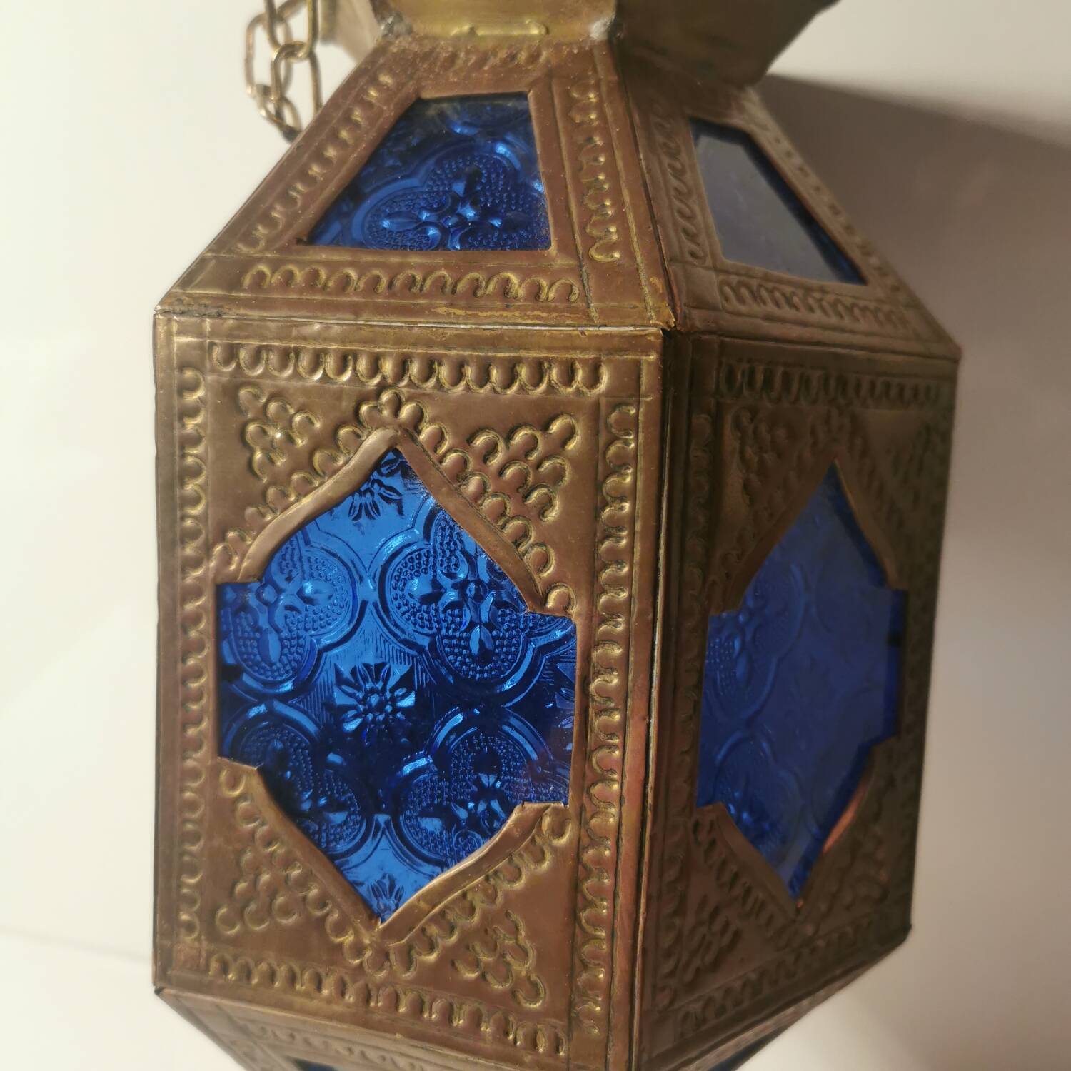 Oriental style hanging lantern in brass and dark blue glass