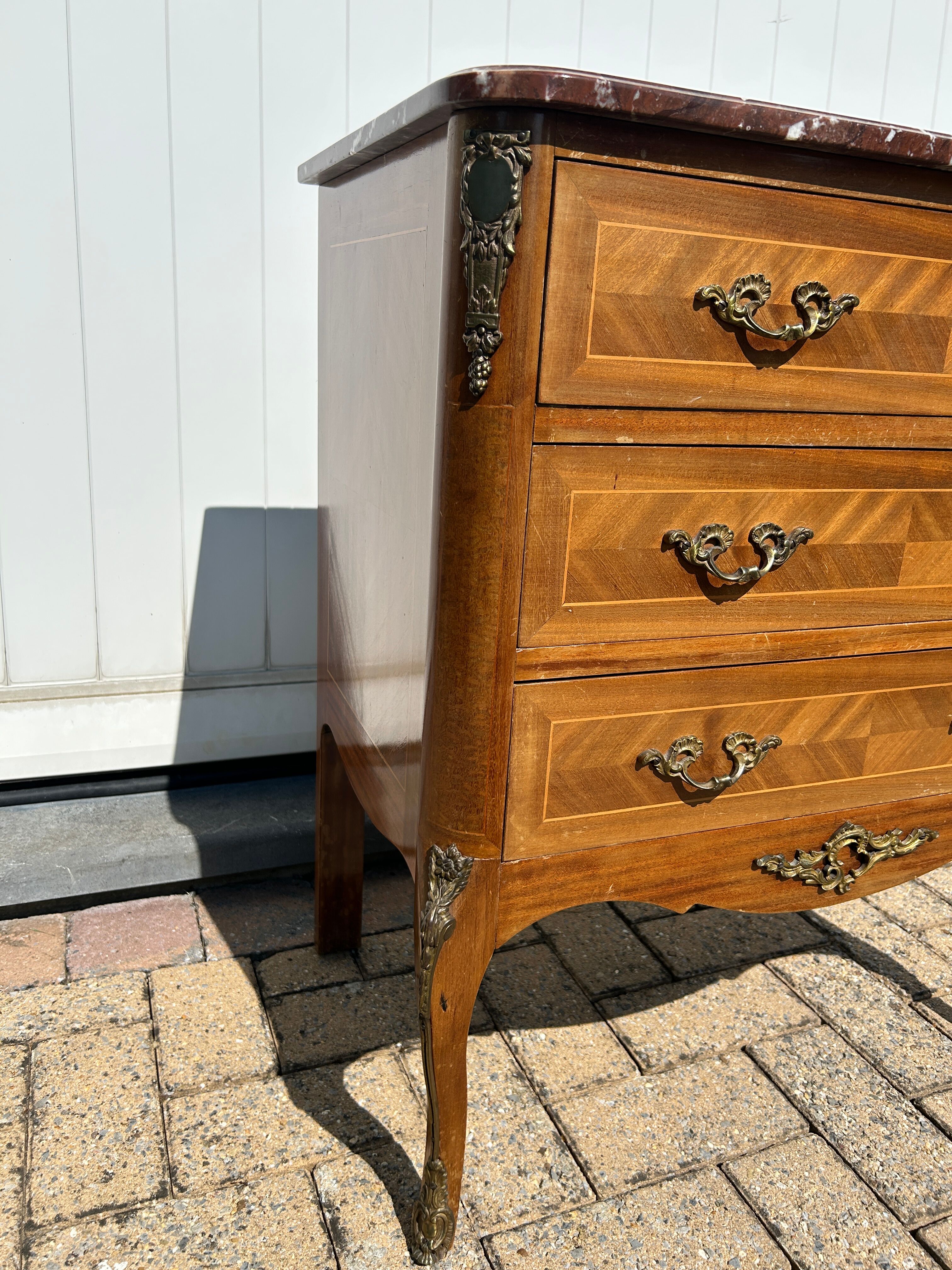 Marquetry commode in transitional style