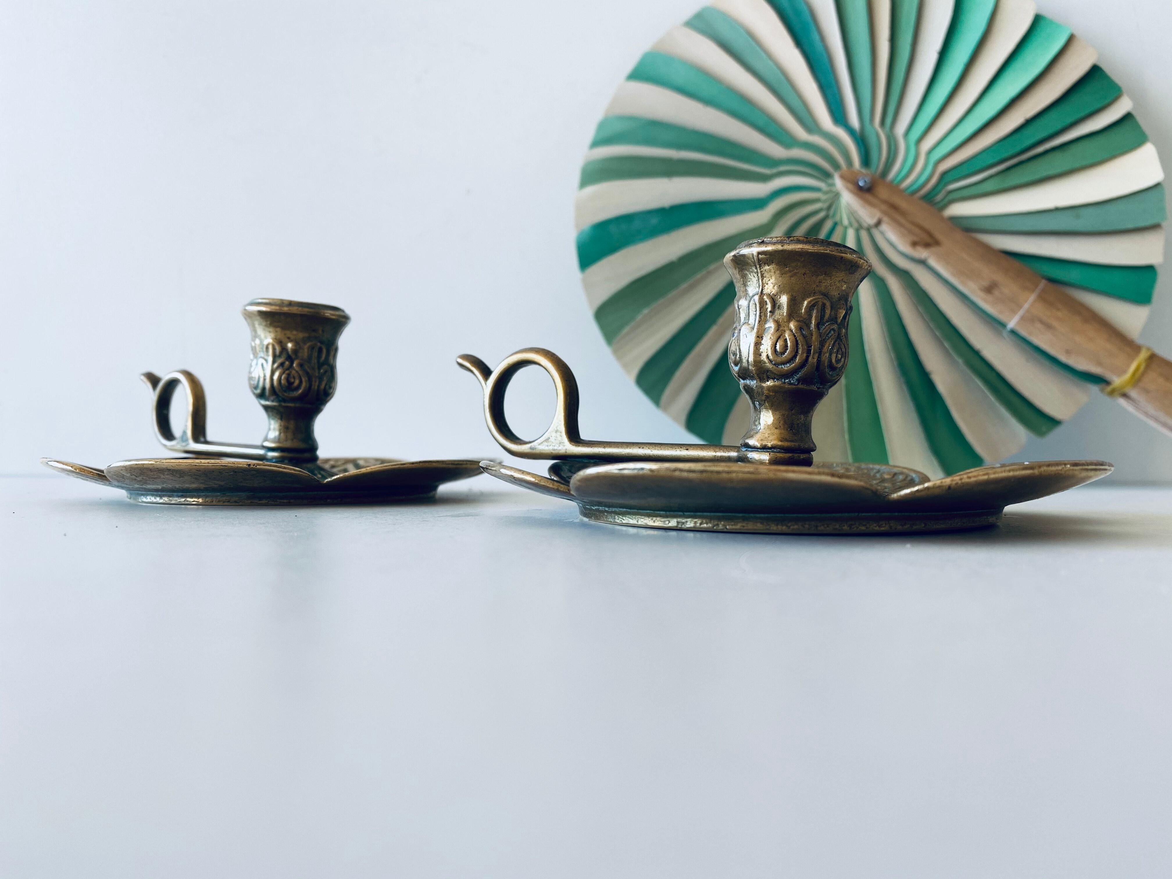 Pair of brass clover candlesticks