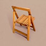 Old varnished wooden folding chair for children