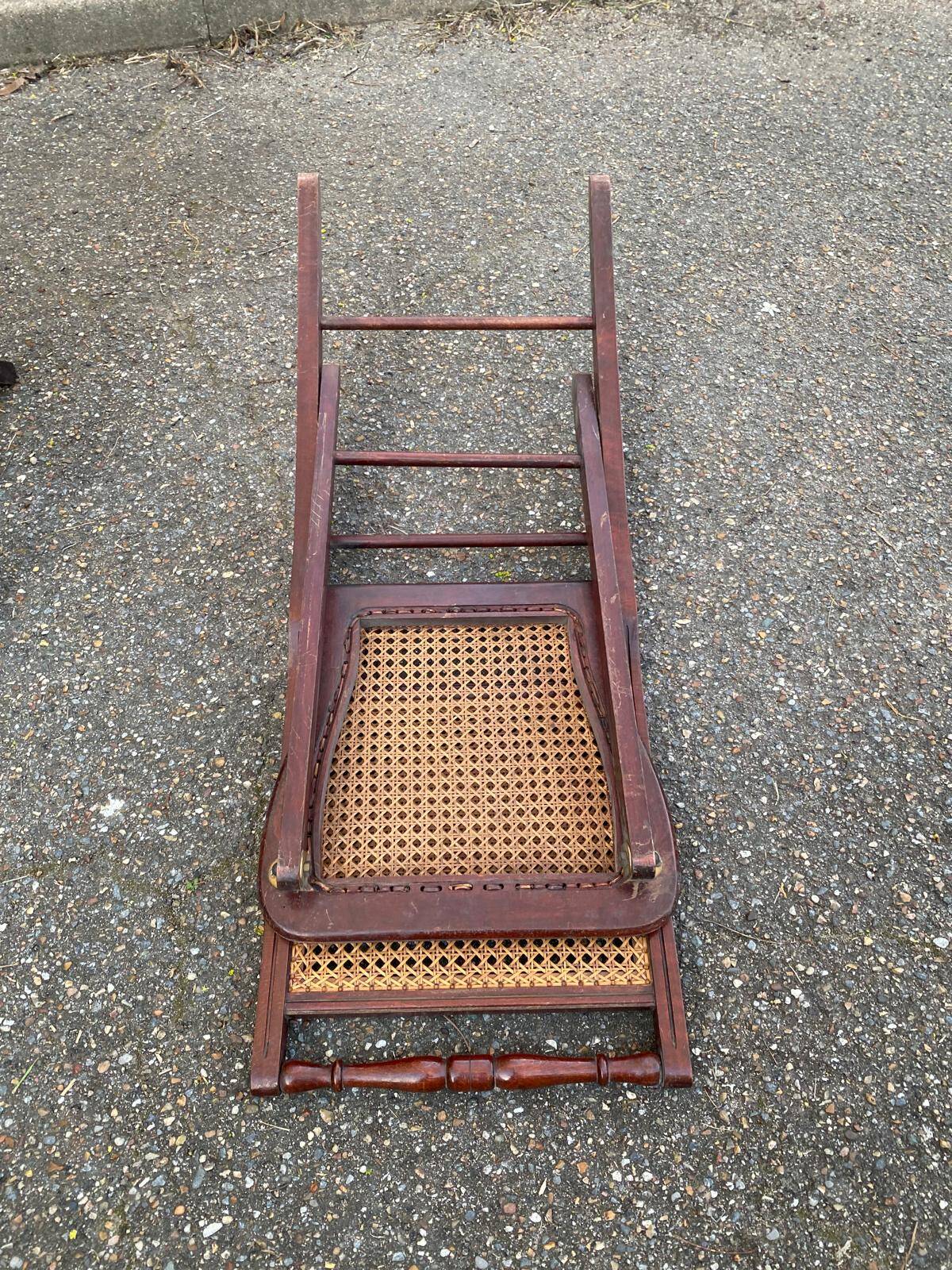 4 cane-seated solid wood folding chairs to be repaired.
