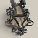 Black wrought iron lantern with stained glass. Medieval, Gothic decoration.