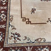 Persian rug in beige wool with woven flowers 290x190cm