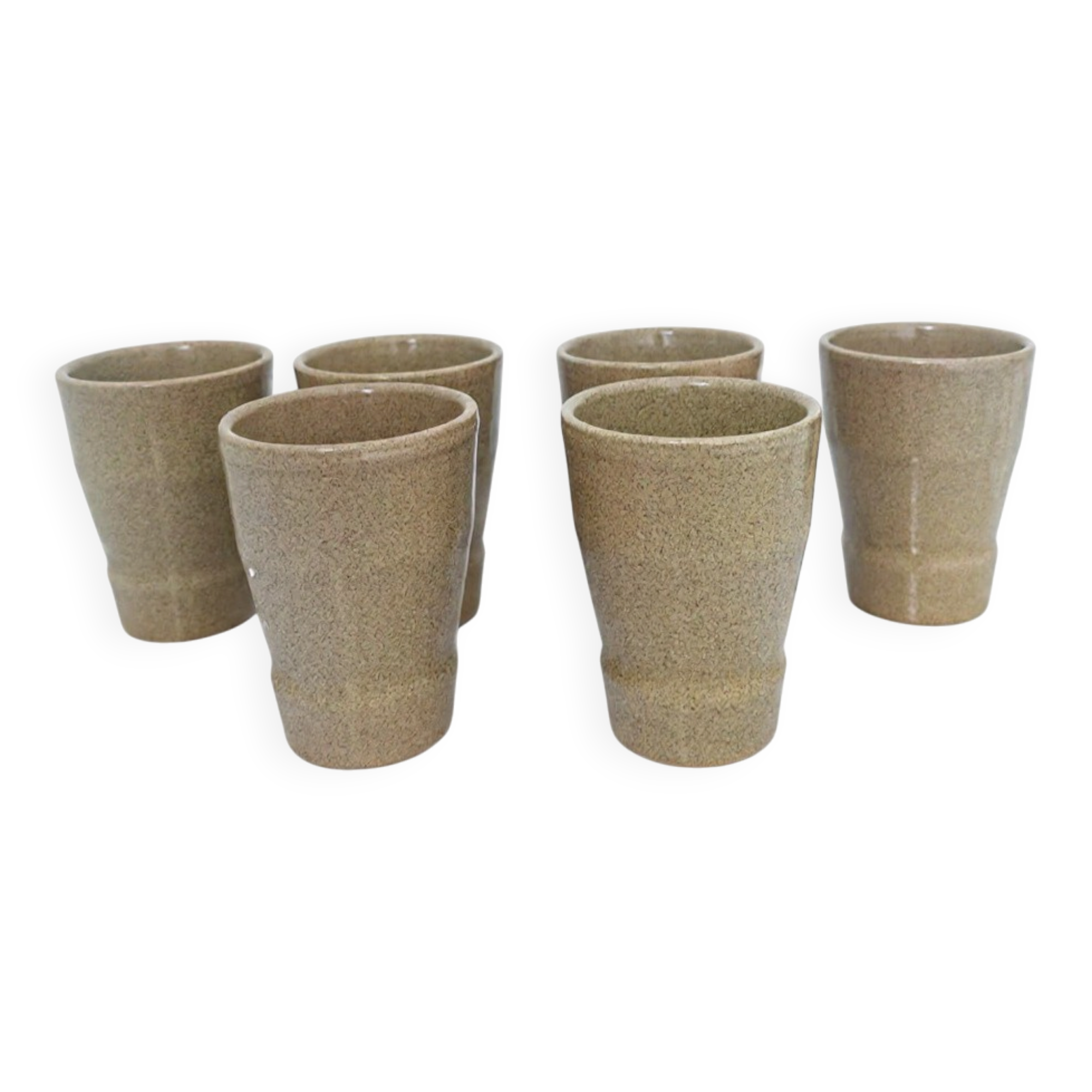 Set of 6 stoneware cups signed Cermer. Beige speckled, matte granular finish.
